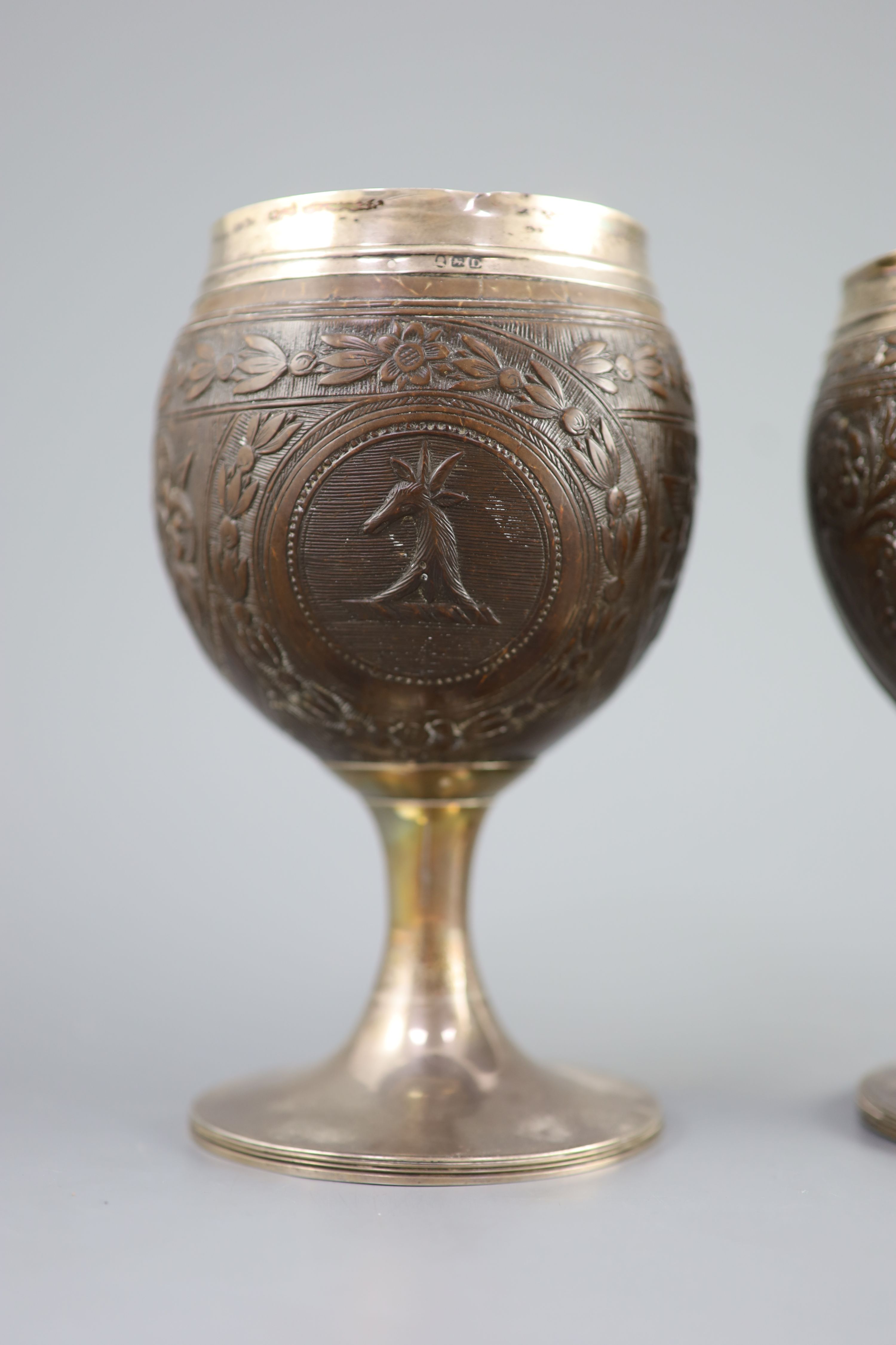 A pair of George III silver mounted coconut cups by Phipps & Robinson